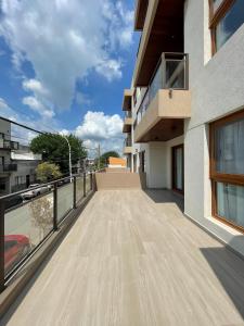 a balcony with a view of a building at EN EL CENTRO DE LOBOS in Lobos