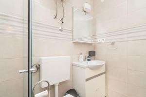 Koupelna v ubytování Apartments Janjac + 37 fotografií