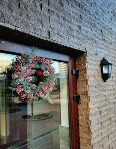 a wreath hanging on the door of a building at Glory in Truskavets