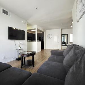 a living room with a couch and a table at Gorgeous 2bdr Home in Marina in Los Angeles
