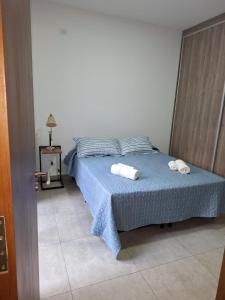 Krevet ili kreveti u jedinici u okviru objekta Moreno Park Complejo Residencial Bloque 5 Dep 1, Lujan de Cuyo