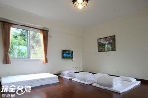 Postel nebo postele na pokoji v ubytování Ti Siang B&B