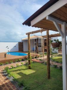 a view of a house with a swimming pool at Chalés Conexão Bahia in Amontada