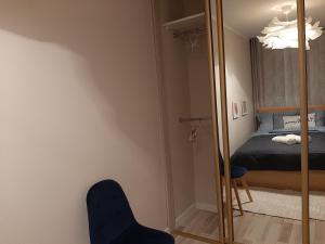 Ένα ή περισσότερα κρεβάτια σε δωμάτιο στο Apartament Wenecja