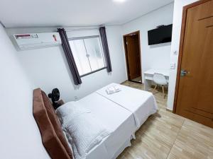 En eller flere senge i et værelse på Lebrinhos hotel