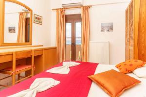 Postel nebo postele na pokoji v ubytování Alexander Beach Hotel