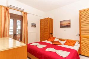Postel nebo postele na pokoji v ubytování Alexander Beach Hotel