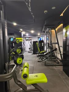 a gym with several treadmills and weights at Hotel Cataleya Al-Hoceima in Al Hoceïma