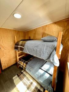 Poschodová posteľ alebo postele v izbe v ubytovaní Parque pomponal