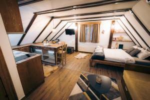 A bed or beds in a room at Vila Bajka