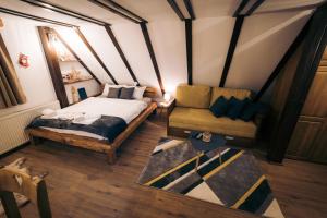 A bed or beds in a room at Vila Bajka