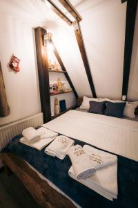 A bed or beds in a room at Vila Bajka