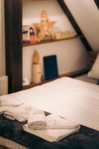 A bed or beds in a room at Vila Bajka