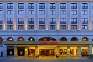 a building with a sign that reads westin grand at The Westin Grand Berlin in Berlin
