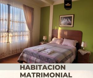 Ένα ή περισσότερα κρεβάτια σε δωμάτιο στο Amplio Departamento con terraza