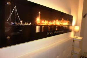 a picture hanging on a wall in a room at NicaDomus B&B in Licata