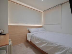 Postel nebo postele na pokoji v ubytování J5 Hostel