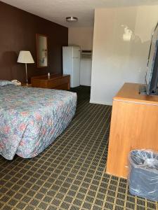 Postel nebo postele na pokoji v ubytování Aaron Motel