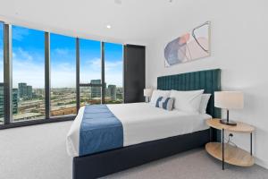 Postel nebo postele na pokoji v ubytování Aspire Melbourne