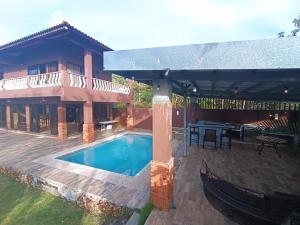 a house with a swimming pool and a patio at Hacienda Chicá in Chicá