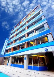 a large building with blue and white at 盤古捷旅 - Panco Hotel in Taipei