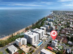 an aerial view of a city with a street sign at Suttons Cove in Redcliffe +14 photos