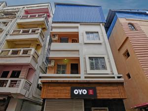 a building with a yes sign in front of it at HOTEL DASH LIVING in Dum Dum