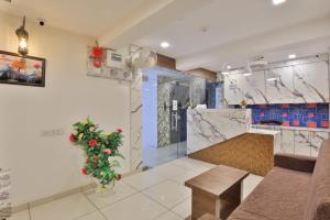 a kitchen with a christmas tree in a room at HOTEL REST INN in Gandhinagar