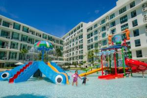 a group of children playing in a water park at Wyndham La Vita Rawai Phuket in Rawai Beach