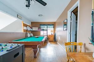 a living room with a pool table in it at Heavenly View - Bear Themed Cabin, HotTub, Dog-Friendly, Near Gatlinburg in Gatlinburg