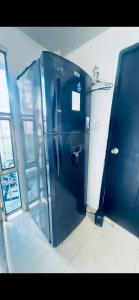 a metal elevator in a room in a building at Estudio KliBeño in Cartagena de Indias +3 photos