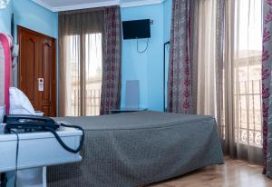TV a/nebo společenská místnost v ubytování Hotel Tibur