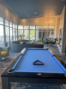 a large room with a pool table in it at Stylish Modern 3bd-2ba With Amenities in Daytona Beach