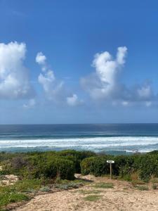 a view of the ocean from a beach at Marien Beach House in Glentana +21 photos