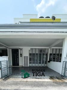 a building with a sign that reads rumanati tico at Rumah Tiga Tingkat in Kuantan +55 photos