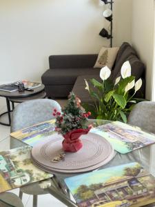 a living room with a table with a christmas tree on it at Cosy Sunlit Home Away from Home in Baulkham Hills