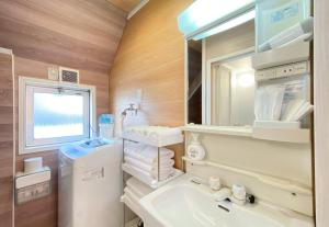 Koupelna v ubytování Mitomi Home 4F + 16 fotografií