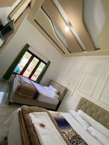 Katil atau katil-katil dalam bilik di Homestay Dieng Adiputra Syariah