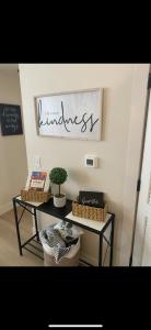 a table with two baskets and a sign that reads kindness at Sapphire desire in Indianapolis