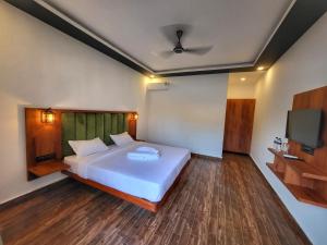Rashiva Resort客房内的一张或多张床位
