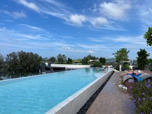 a large swimming pool on the roof of a building at Laguna Skypark in Phuket