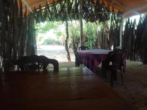 a person doing a yoga pose at a table at By The C' Cabanas in Hikkaduwa