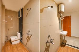 a bathroom with a toilet and a sink at FabHotel Neena Palace in Bhopal