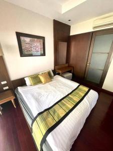 a bedroom with a large bed in a room at Panoramic sea view, 1 bed flat in Ban Bang Bao