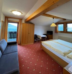 Postel nebo postele na pokoji v ubytování Hotel Hemetsberger + 37 fotografií