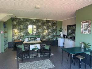 a kitchen and dining room with a table and chairs at Welgemoed Villa in Bellville
