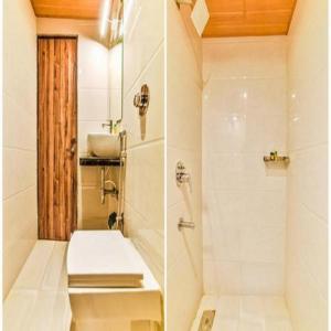 a bathroom with a shower and a toilet and a sink at GATEWAY INN in Mumbai