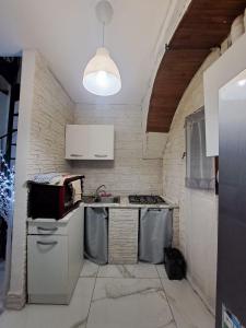 Kuchyň nebo kuchyňský kout v ubytování Carmela e Gennaro casa vacanze