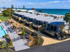 an aerial view of a resort with a pool at Tasman Holiday Parks - Papamoa Beach in Papamoa