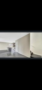 a view of a white room with a table in it at Cosy Room with lock and work area in Truganina +2 photos